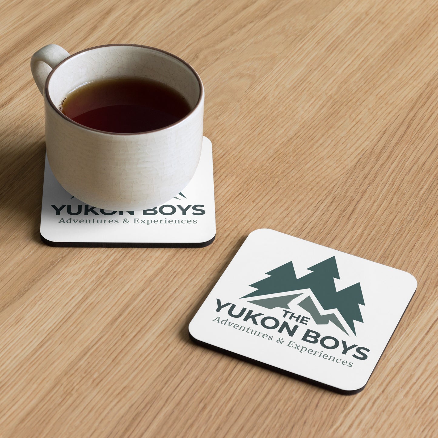 The Yukon Boys cork-back cabin coaster, front view