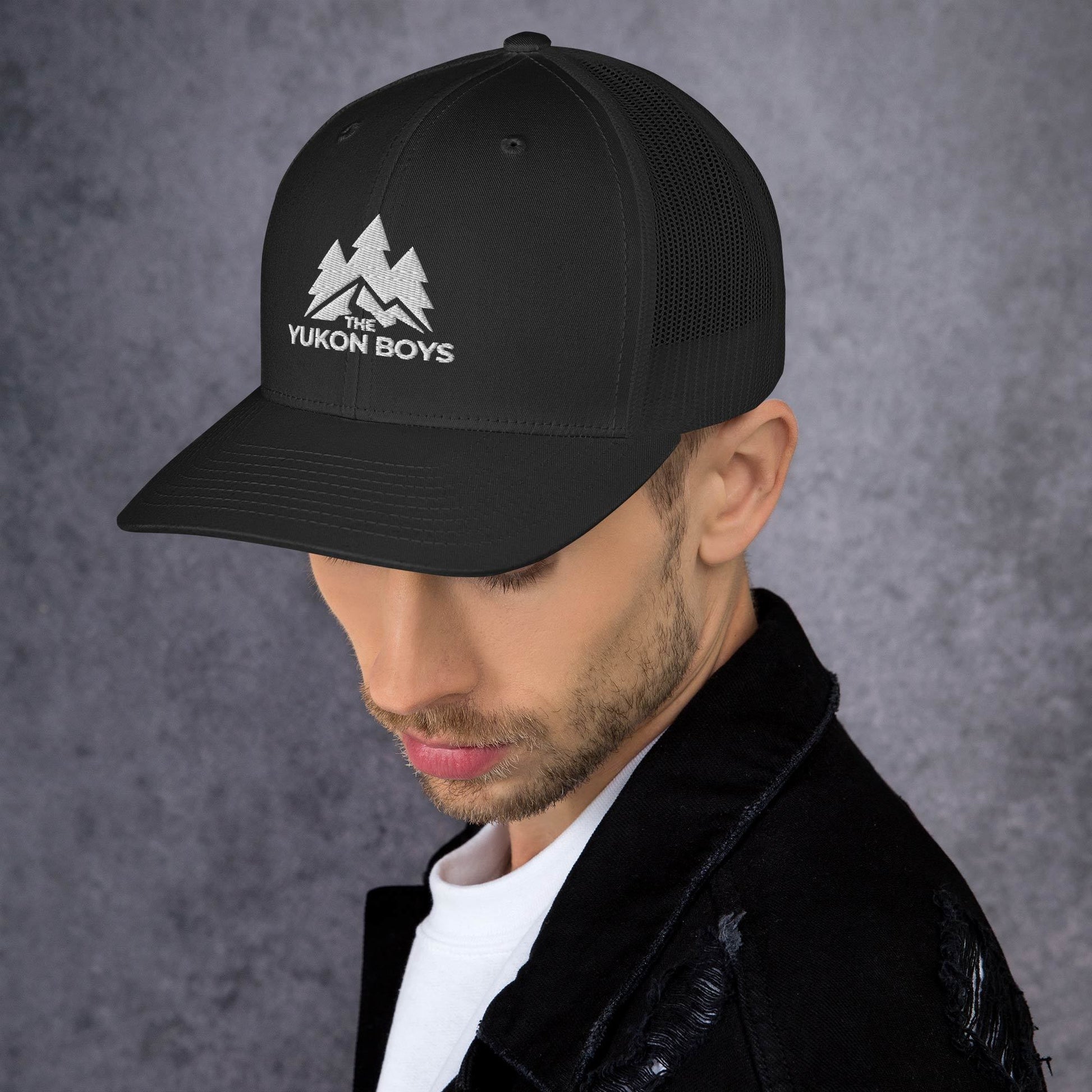 The Yukon Boys Trucker Cap in Black, left side view