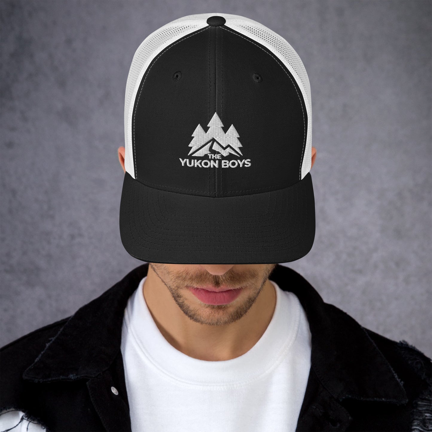 The Yukon Boys Trucker Cap in Black White, front view