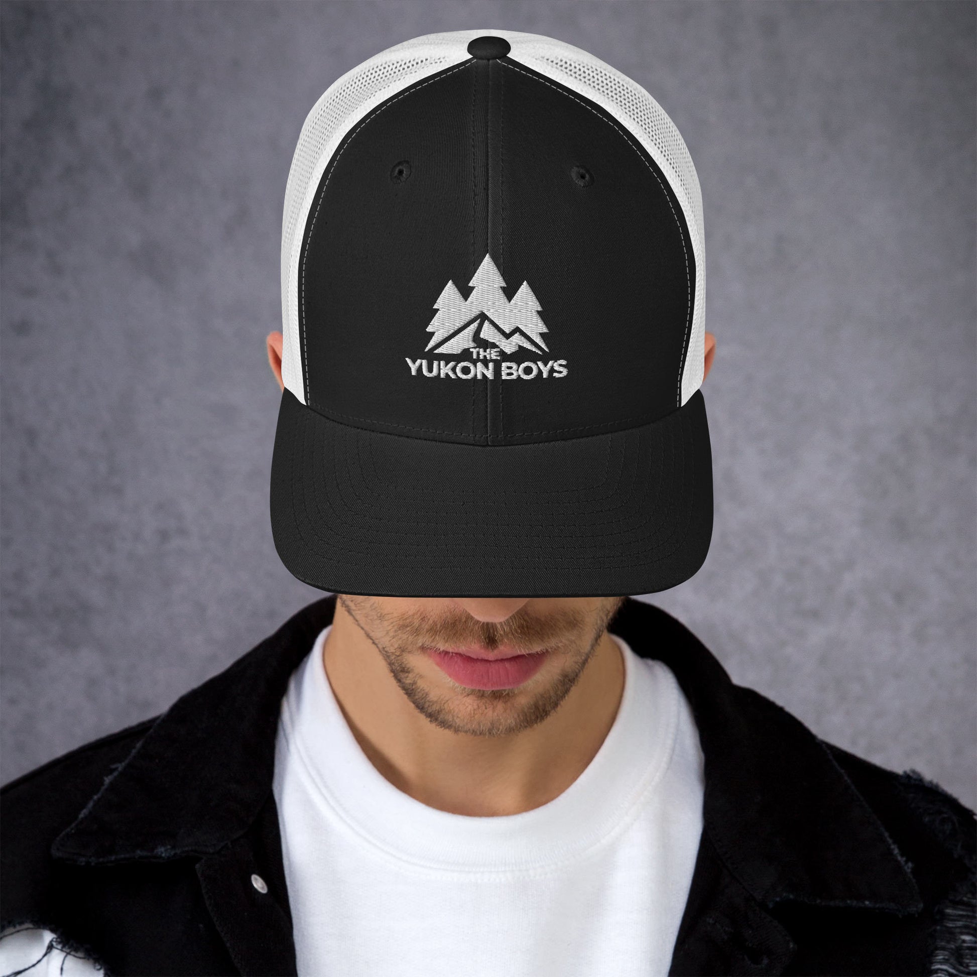 The Yukon Boys Trucker Cap in Black White, front view