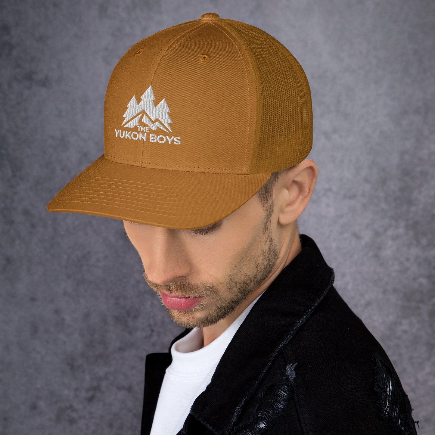 The Yukon Boys Trucker Cap in Caramel, left side view