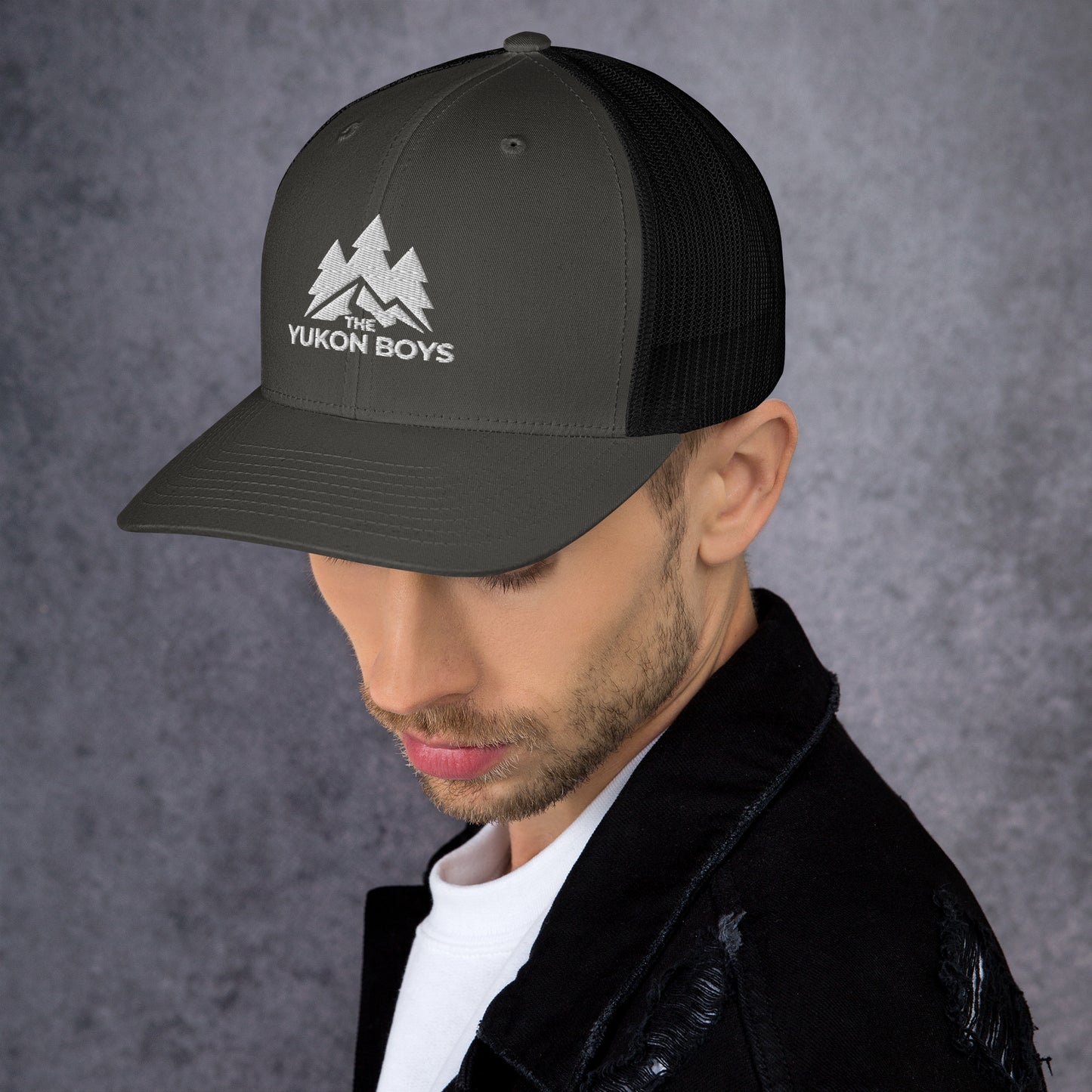 The Yukon Boys Trucker Cap in Charcoal Black, left side view