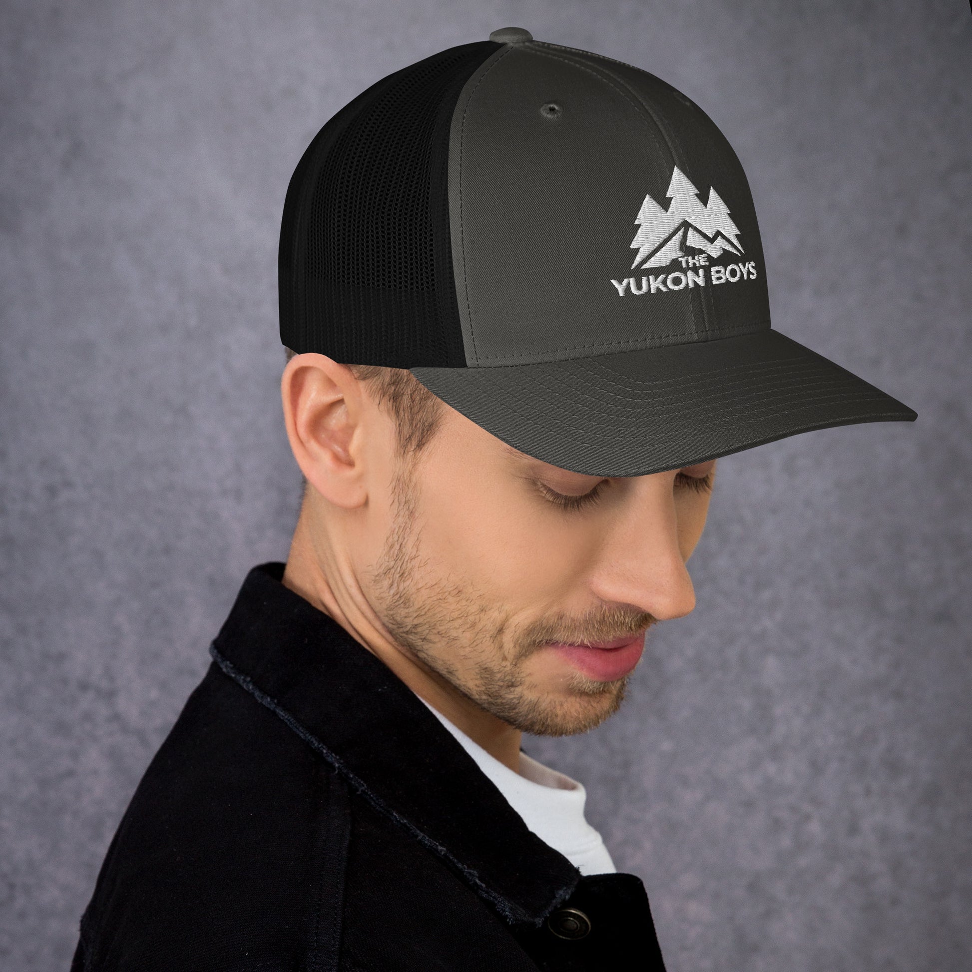The Yukon Boys Trucker Cap in Charcoal Black, right side view