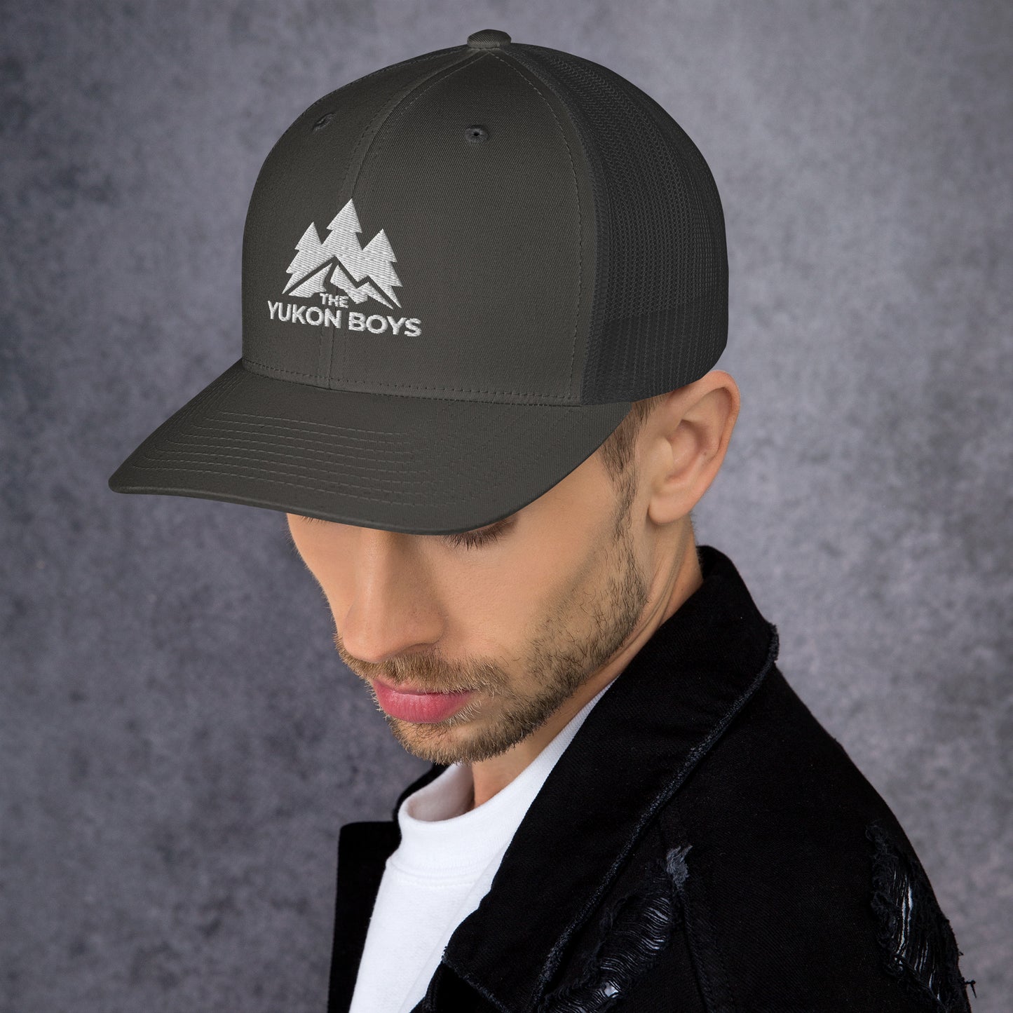 The Yukon Boys Trucker Cap in Charcoal, left side view