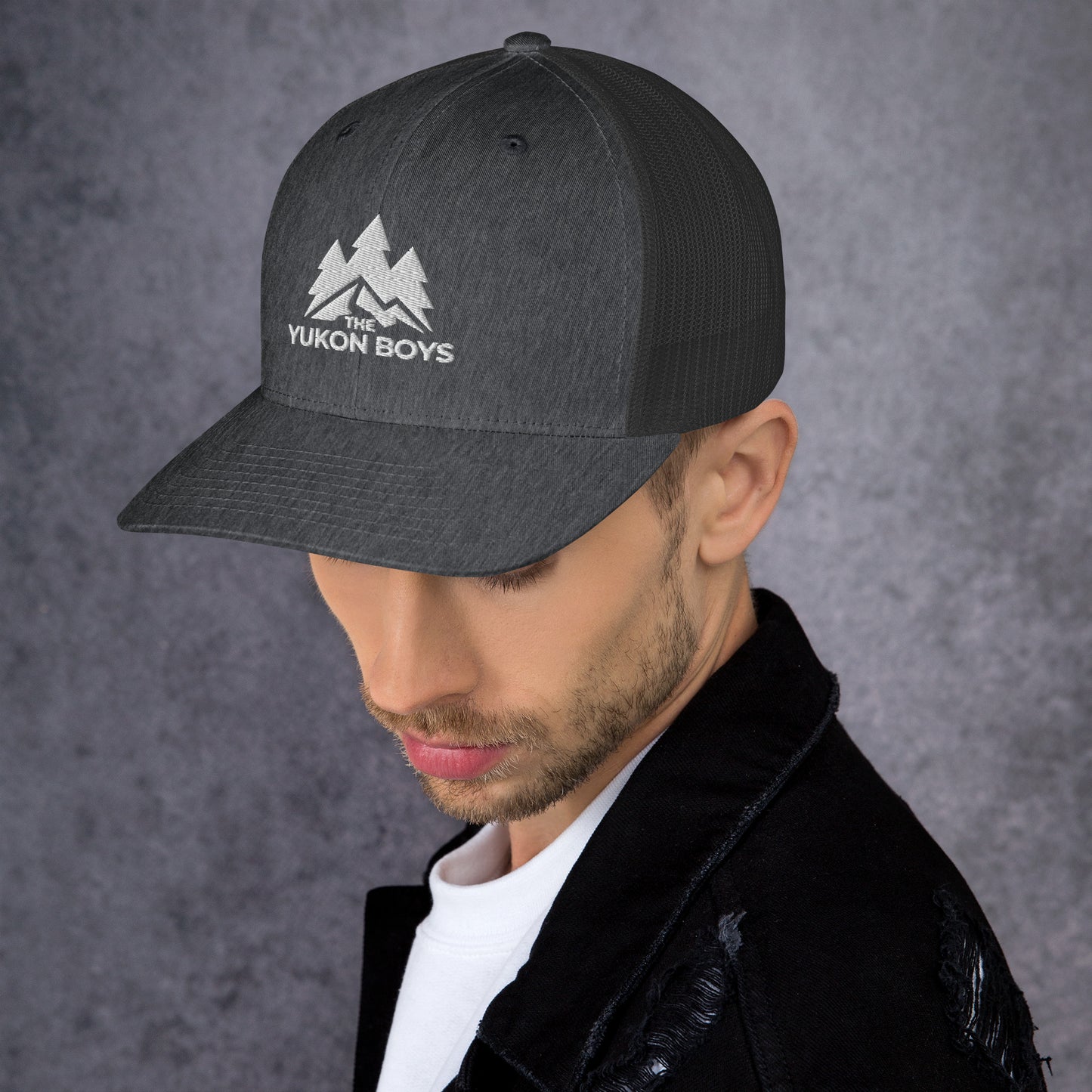 The Yukon Boys Trucker Cap in Dark Heather Gray, left side view