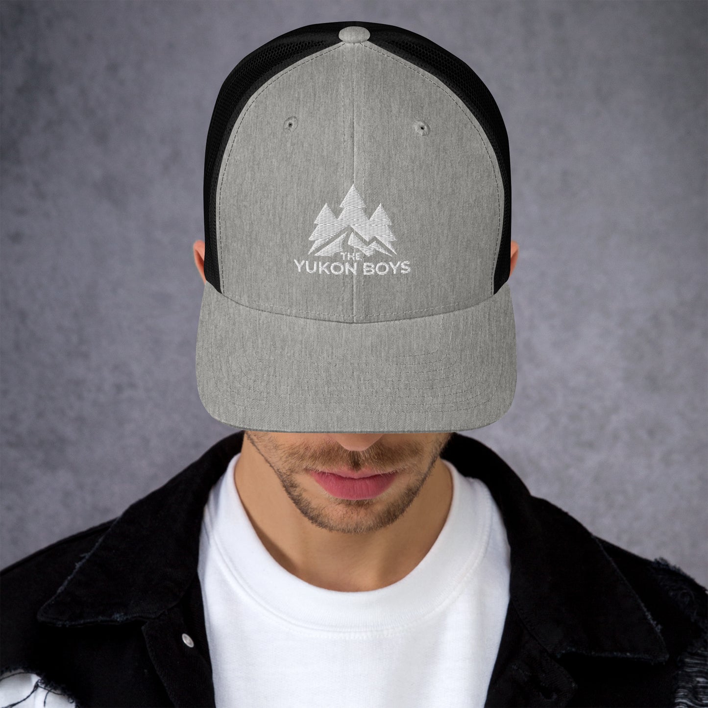 The Yukon Boys Trucker Cap in Heather Black, front view