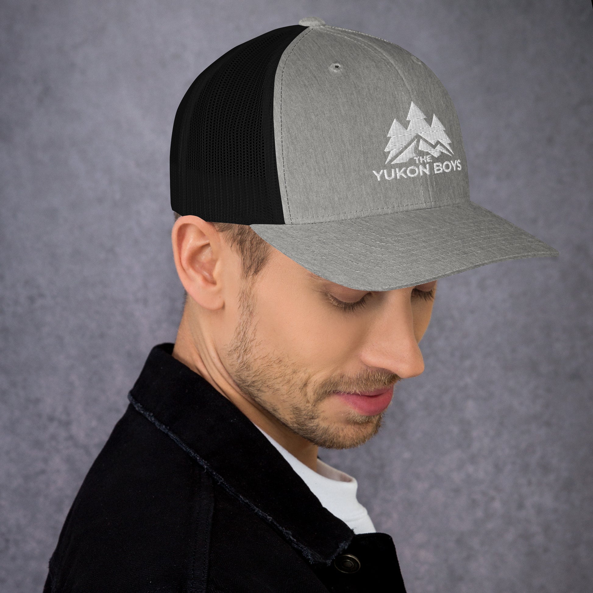 The Yukon Boys Trucker Cap in Heather Black, right side view