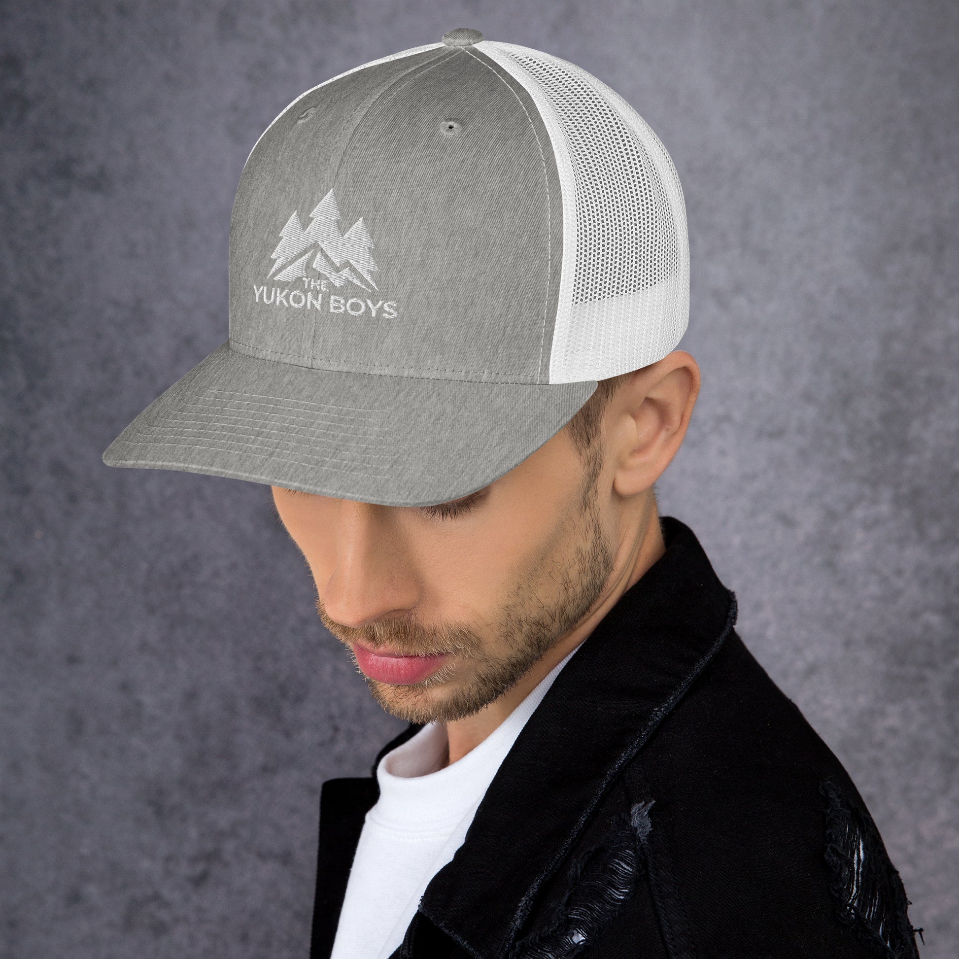 The Yukon Boys Trucker Cap in Heather Grey White, left side view