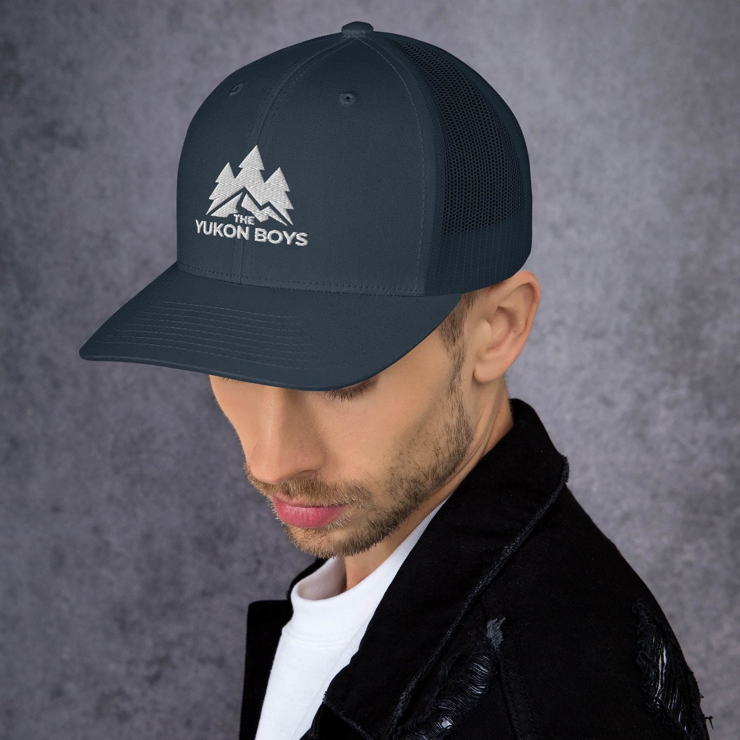 The Yukon Boys Trucker Cap in Navy, left side view