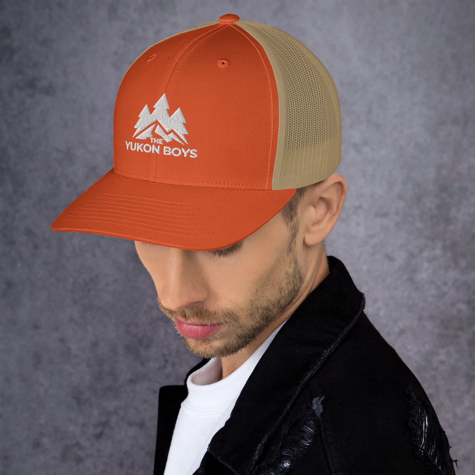 The Yukon Boys Trucker Cap in Rustic Orange Khaki, left side view