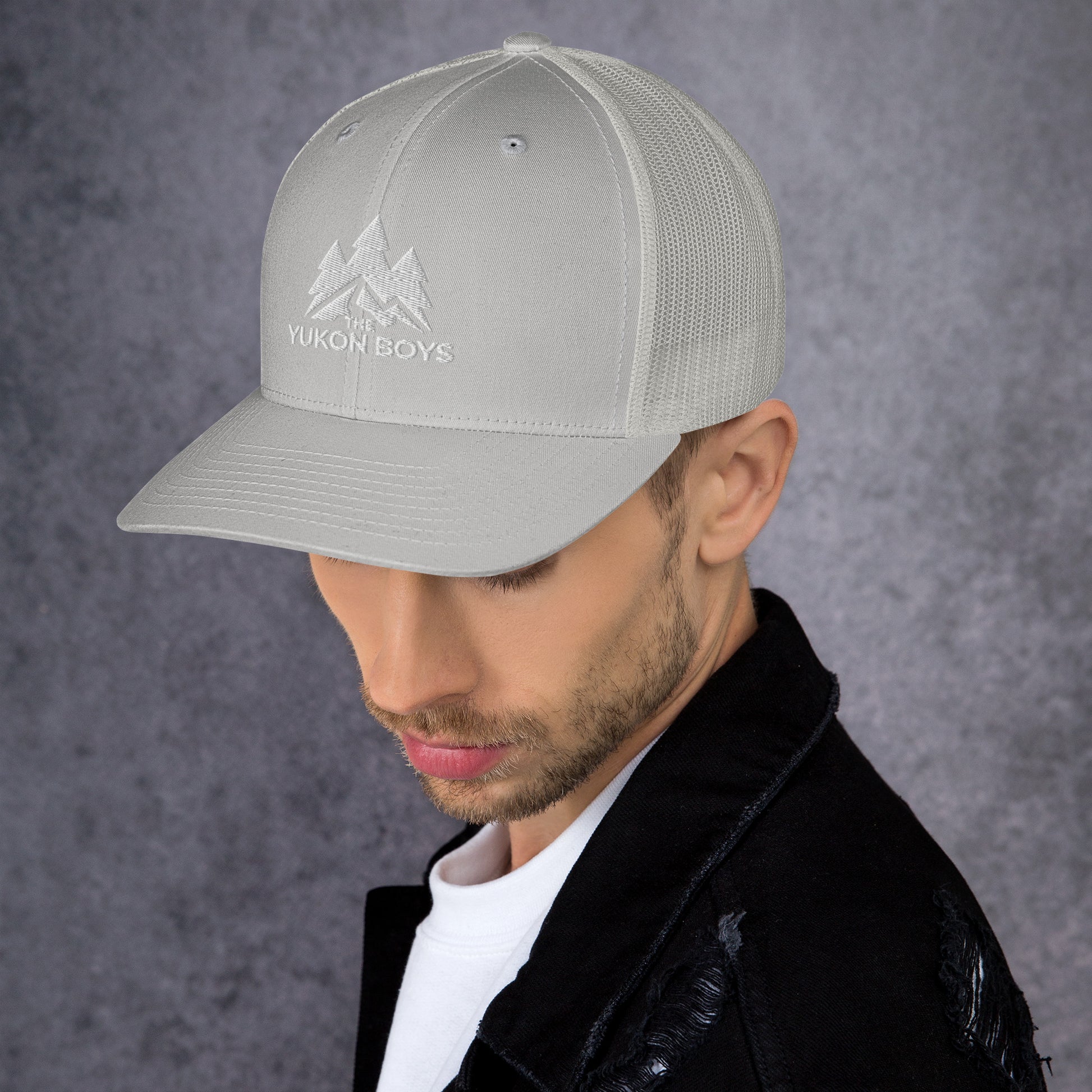 The Yukon Boys Trucker Cap in Silver, left side view